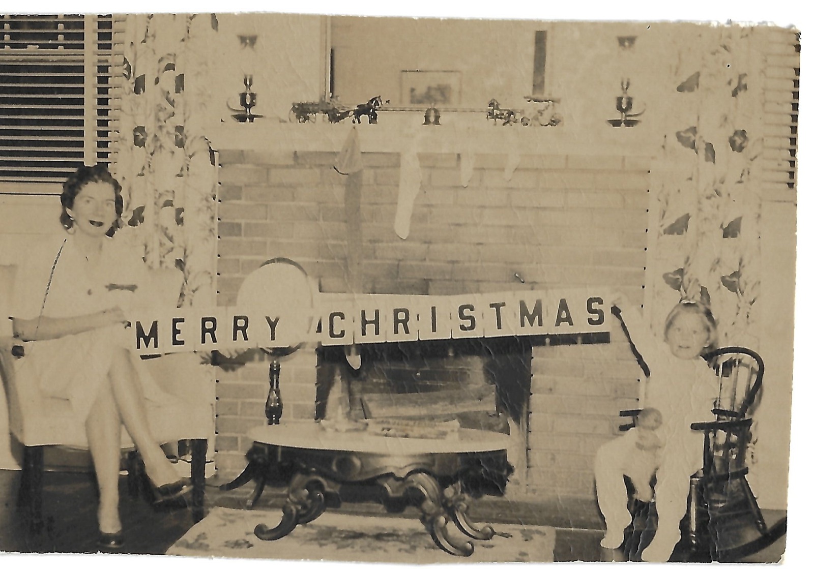 Jean and Betty by the Christmas fireplace