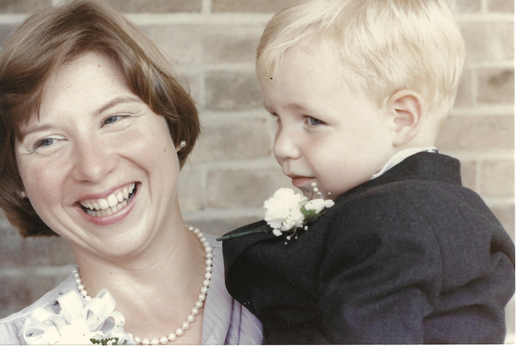 Betty holding her son Dave at a family wedding