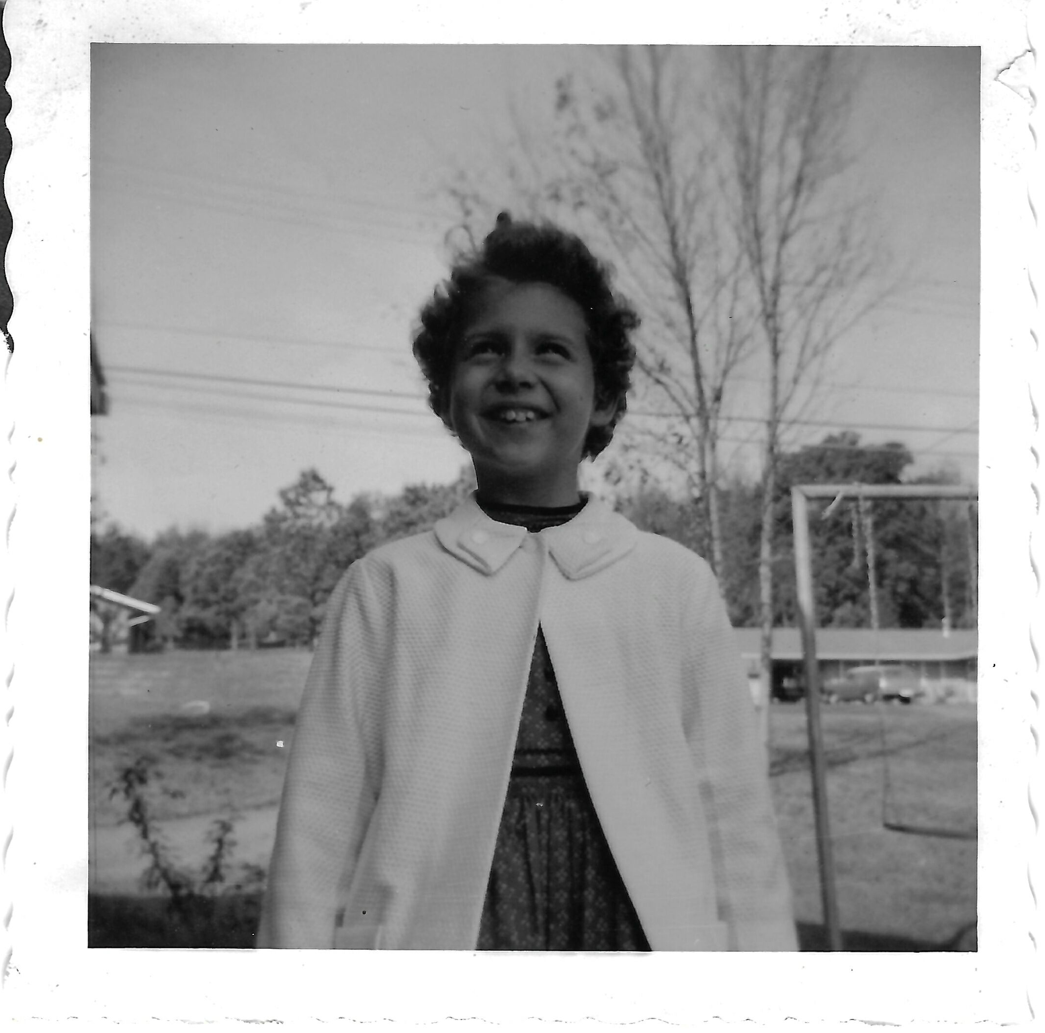 Betty outdoors in a cardigan, 1958
