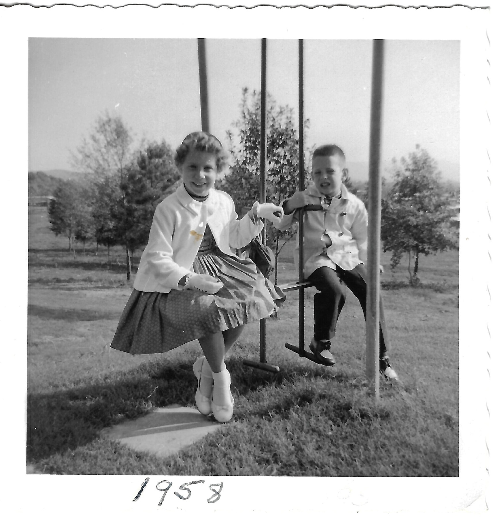 Betty and Bob on swings