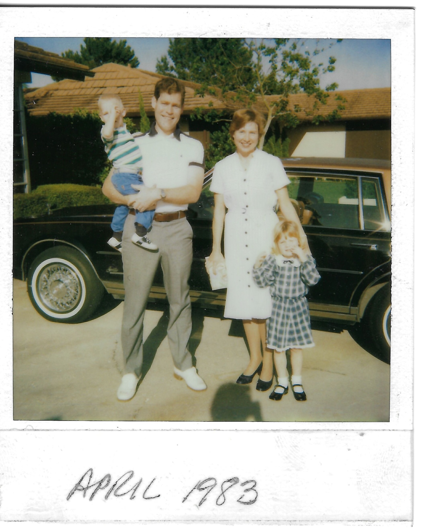 Betty with Dave, Eileen, and David beside the family car