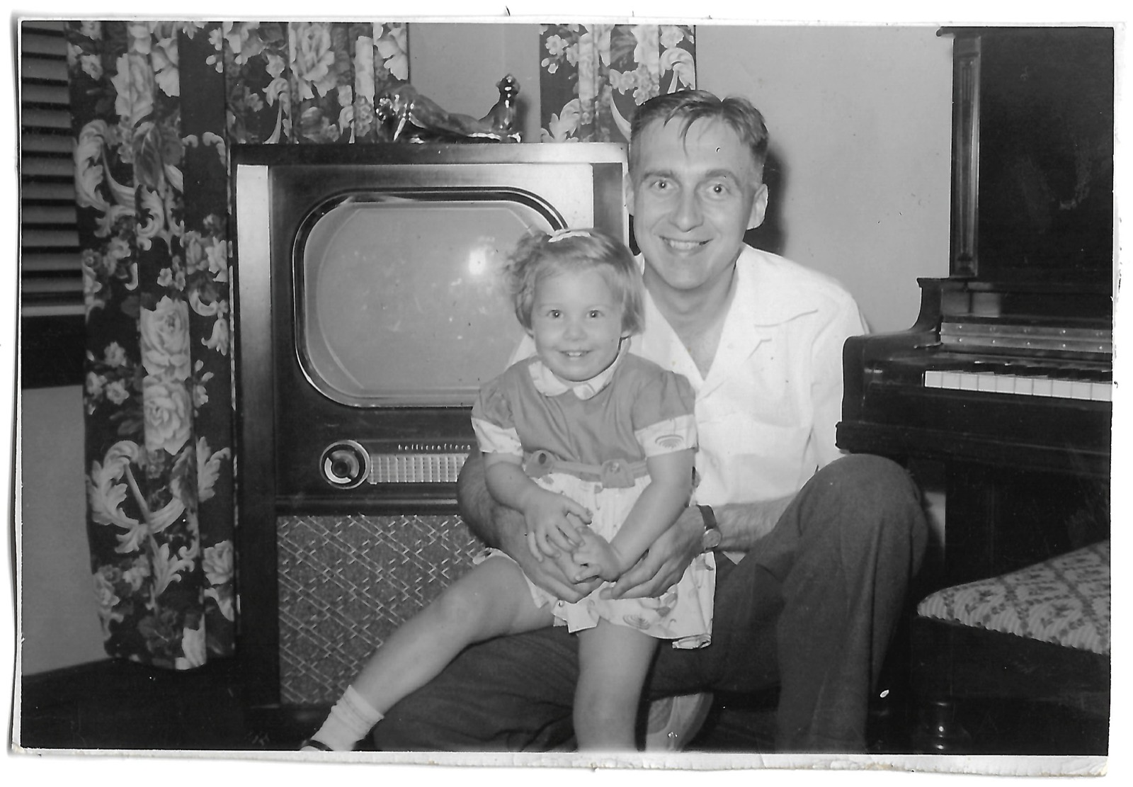 Betty and Jack beside a television
