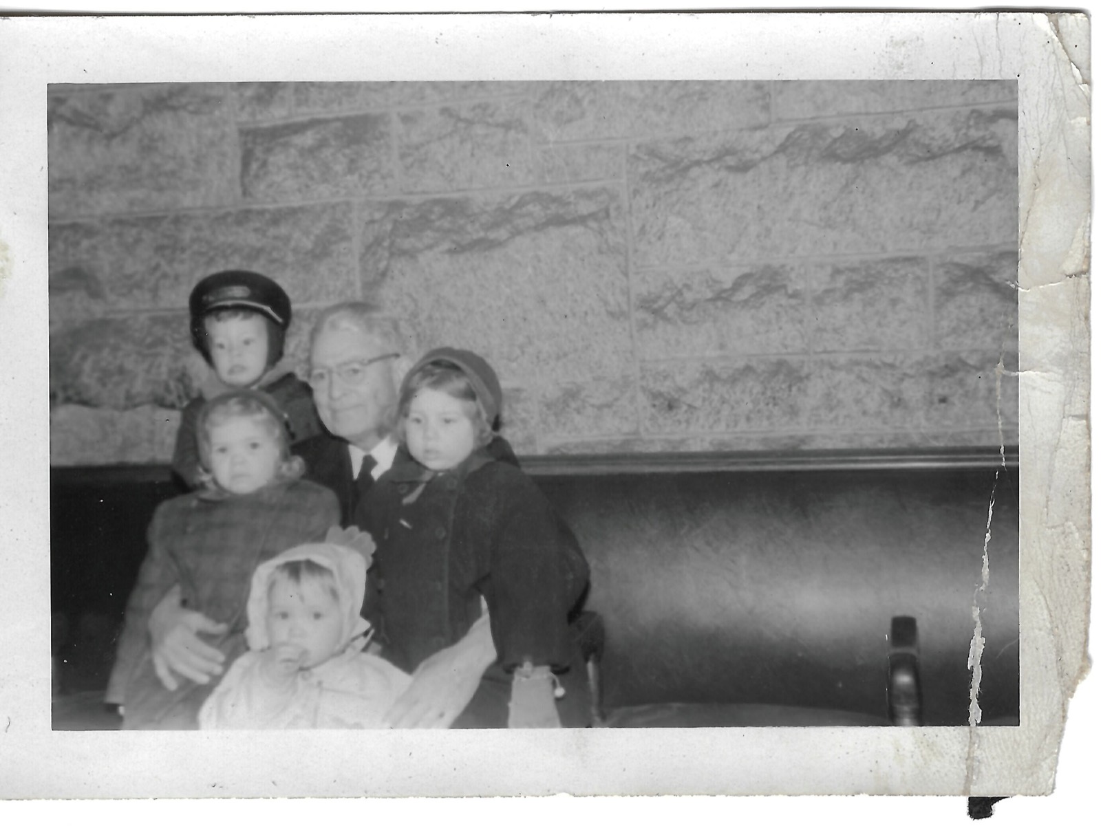 Adult seated with four children