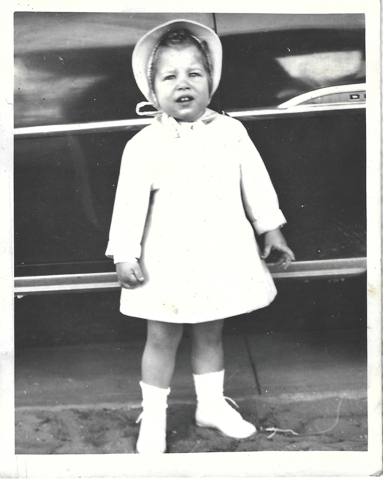 Young Betty in a coat and bonnet