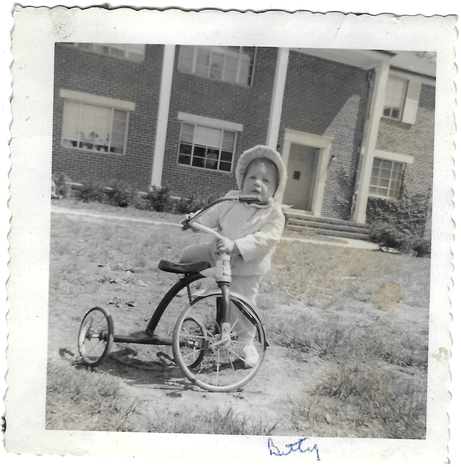 Betty riding a tricycle