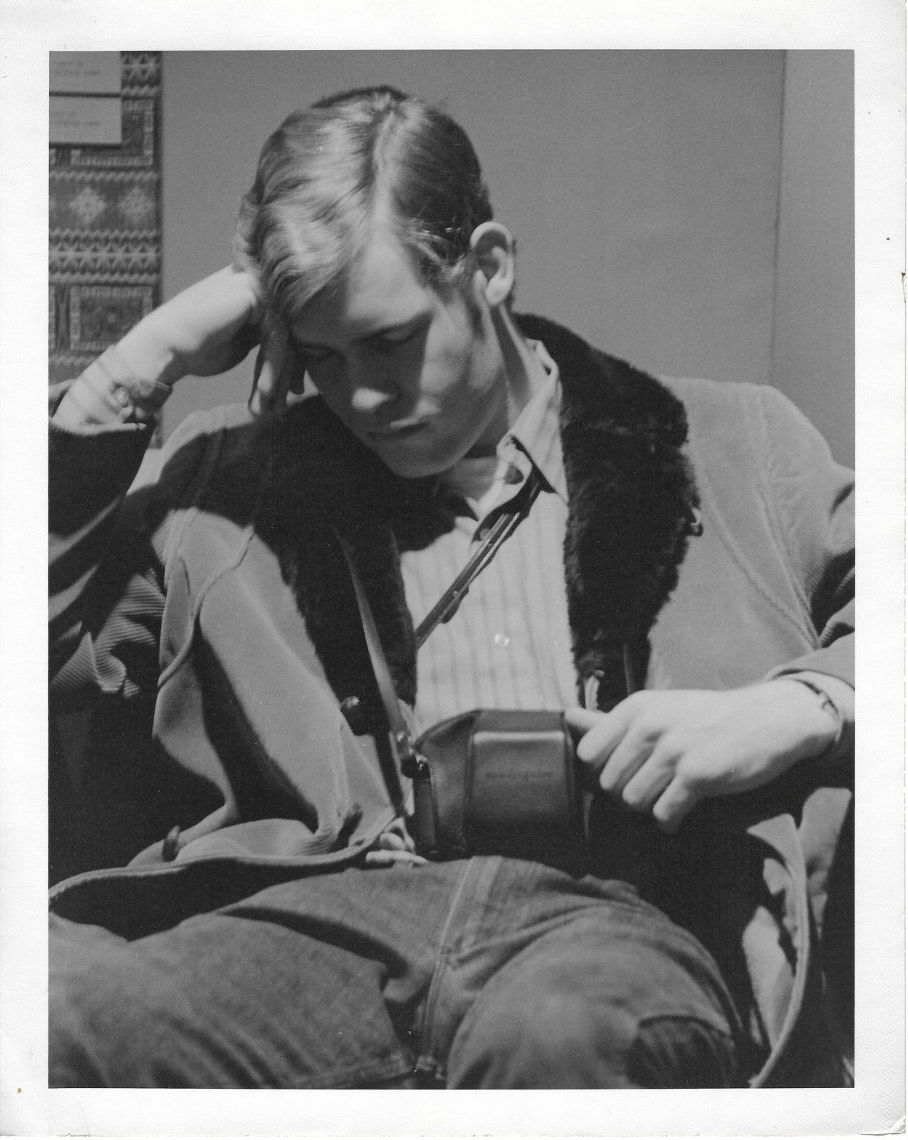 Dave L. Emison seated with a camera