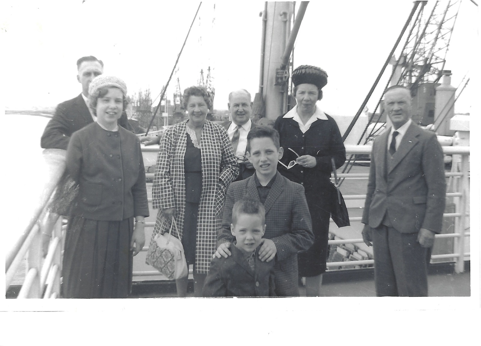 Group standing on a ship deck