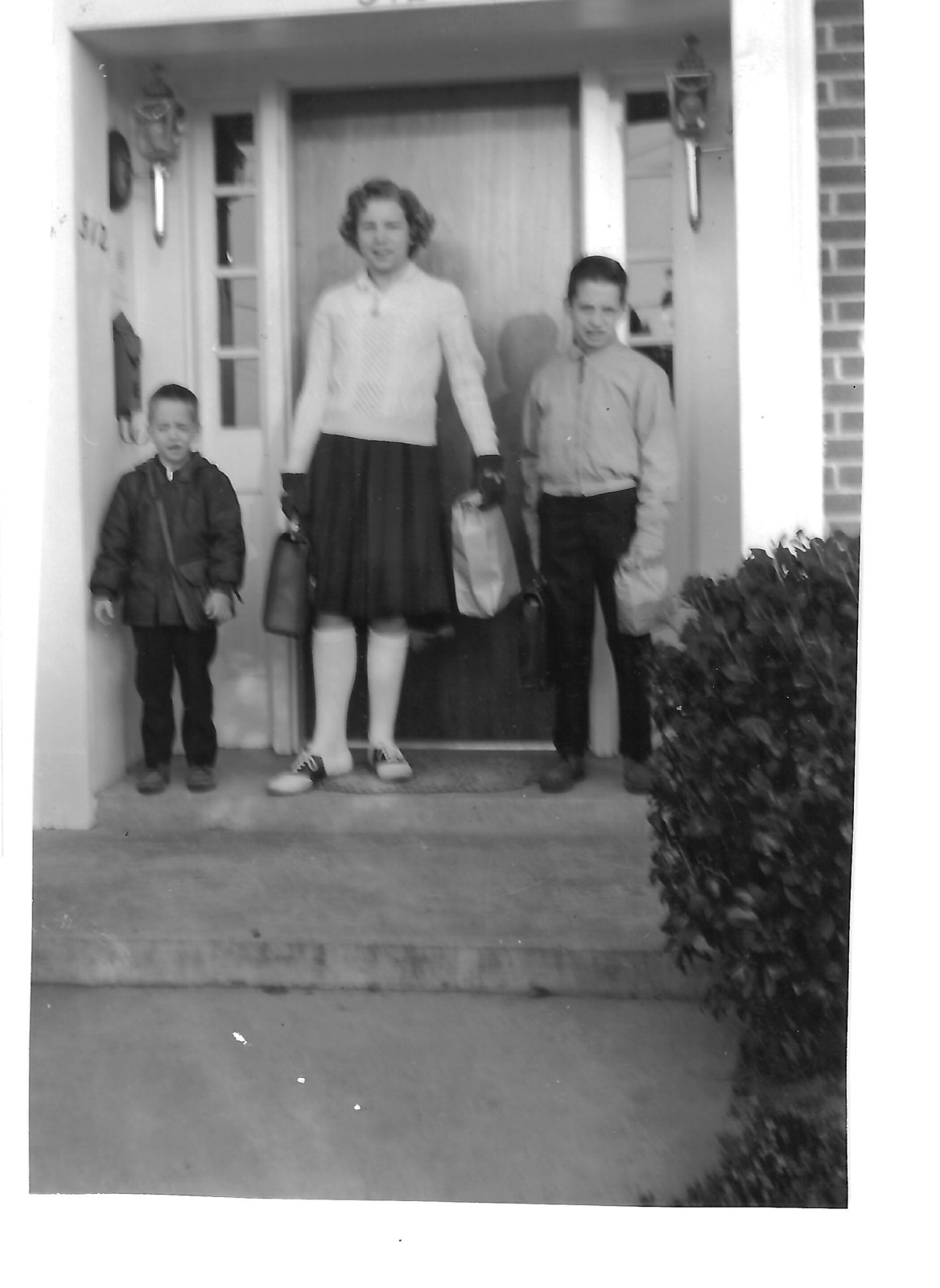 Bill, Betty, and Bob on front steps