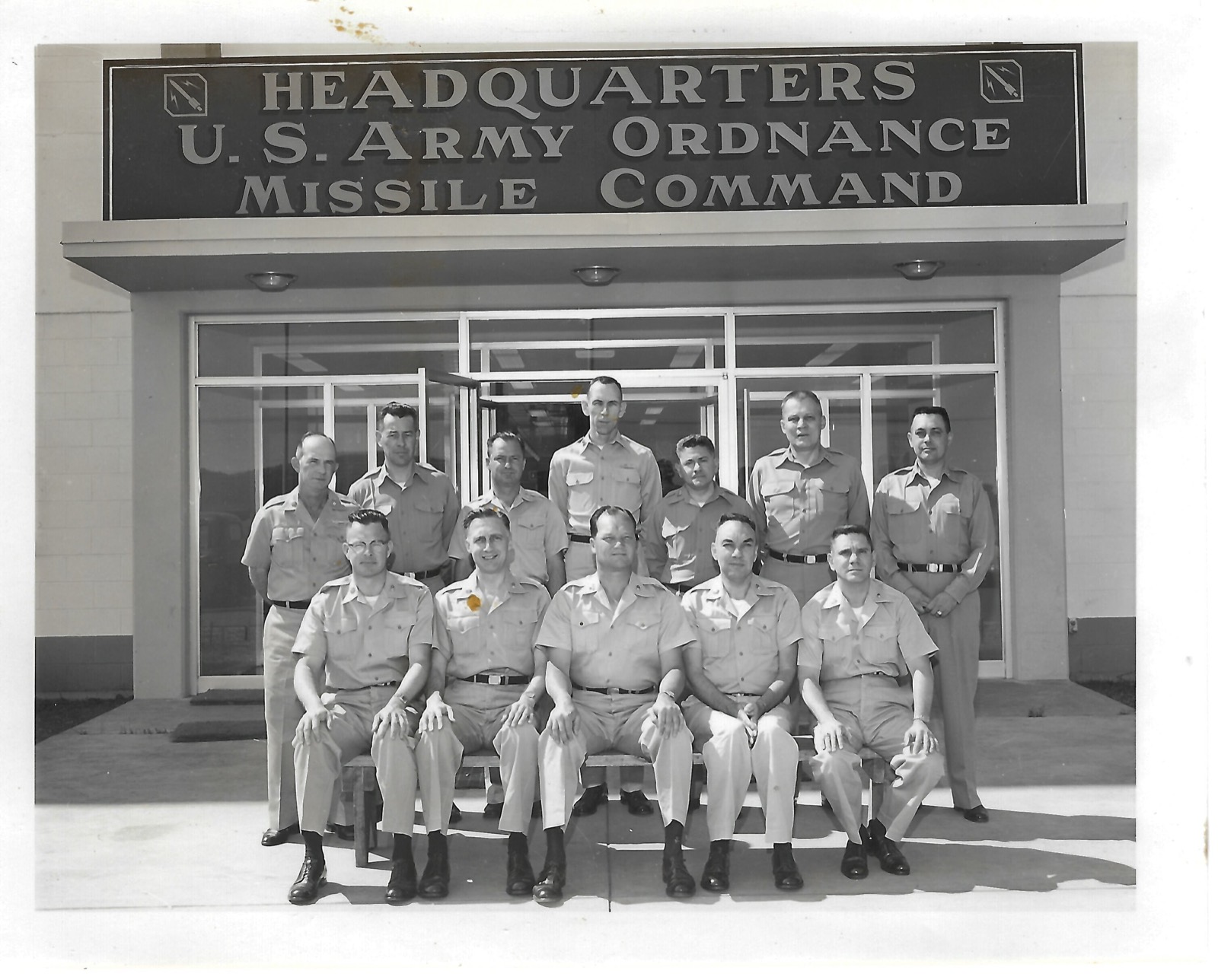 Military group outside headquarters; Jack in front row, second from left