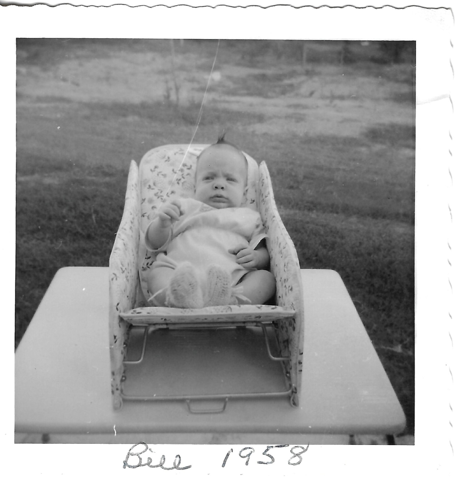 Baby Bill in an outdoor chair