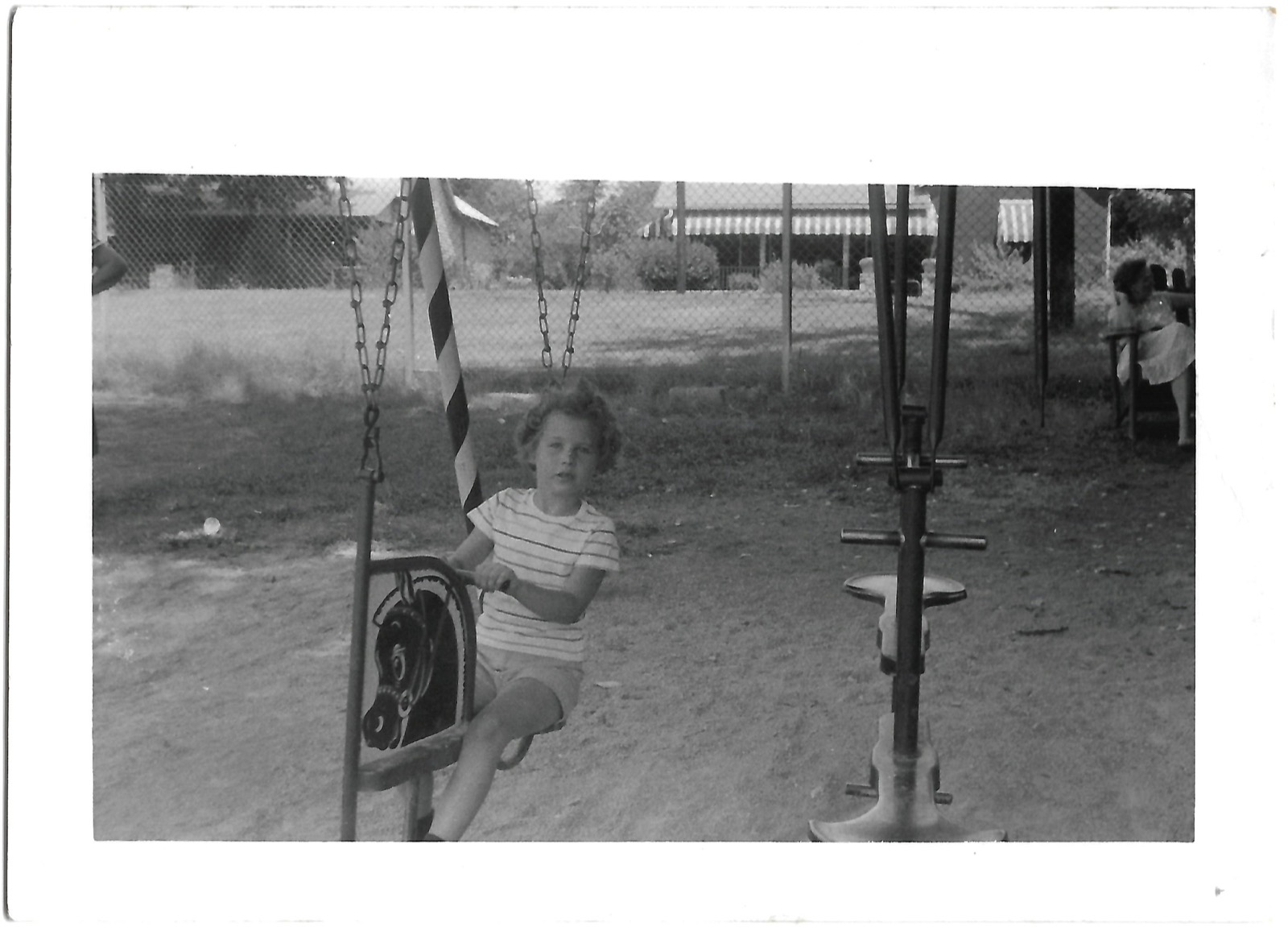 Betty on a playground swing