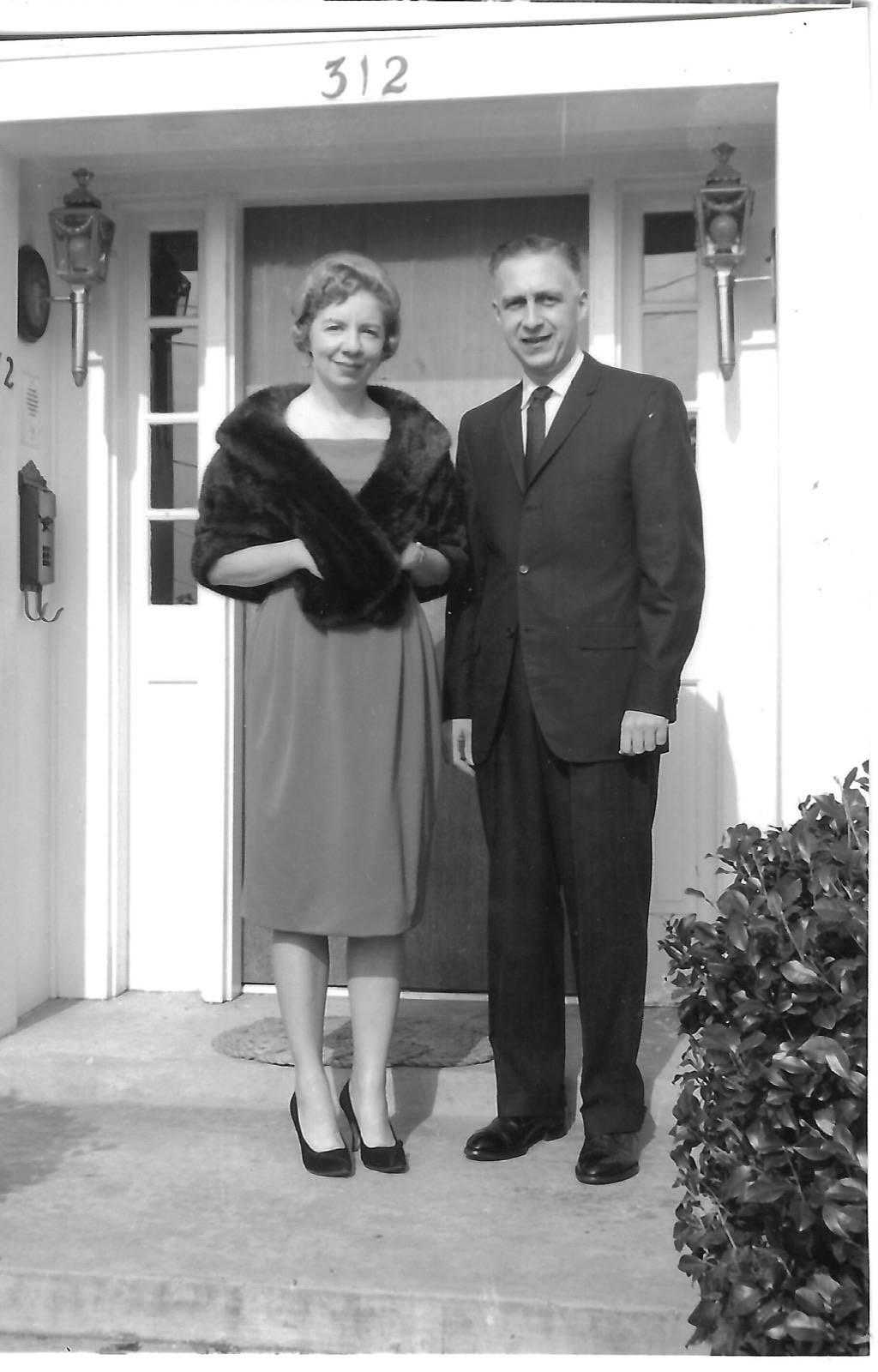 Jean and Jack at a front door