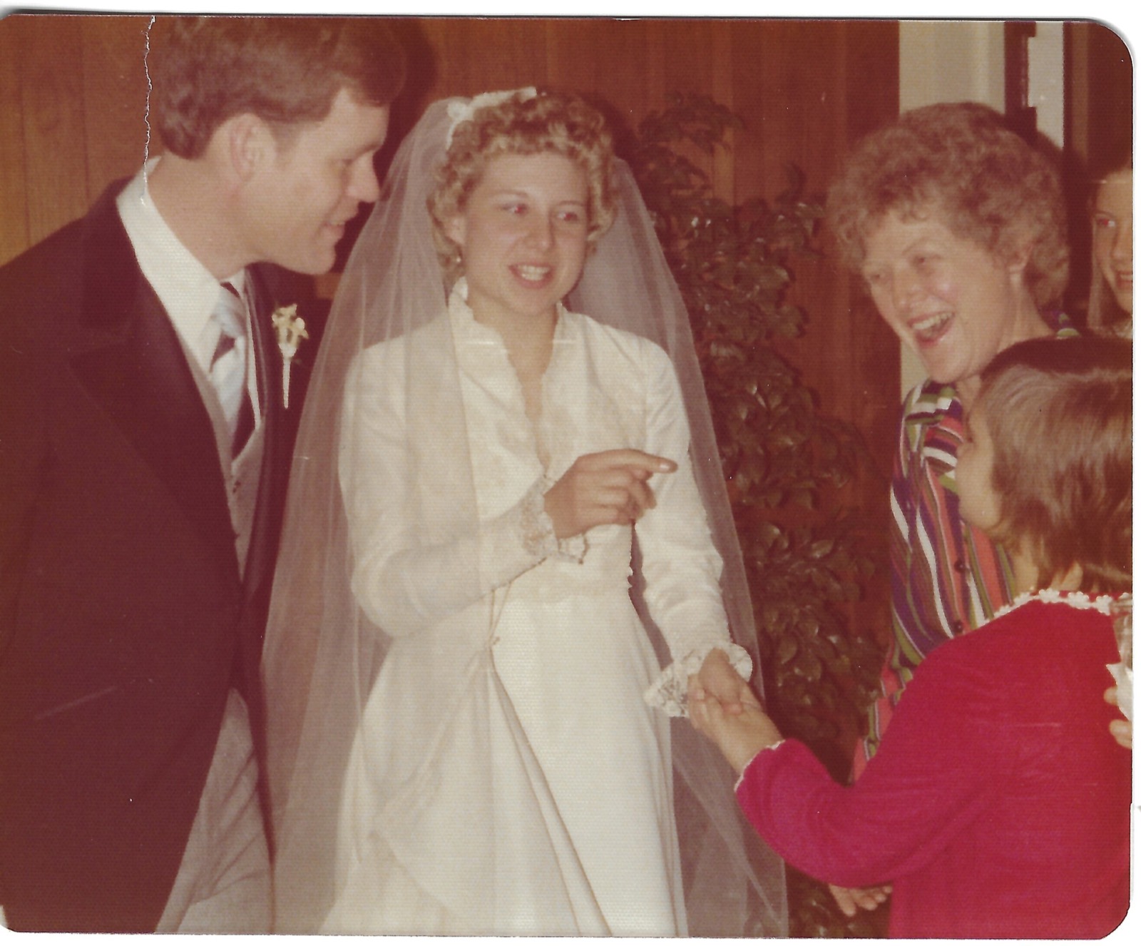 Betty and Dave with family at a wedding