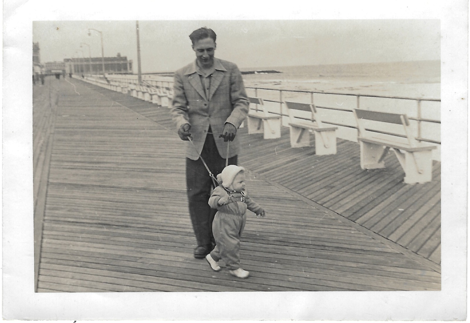 Adult and toddler on boardwalk