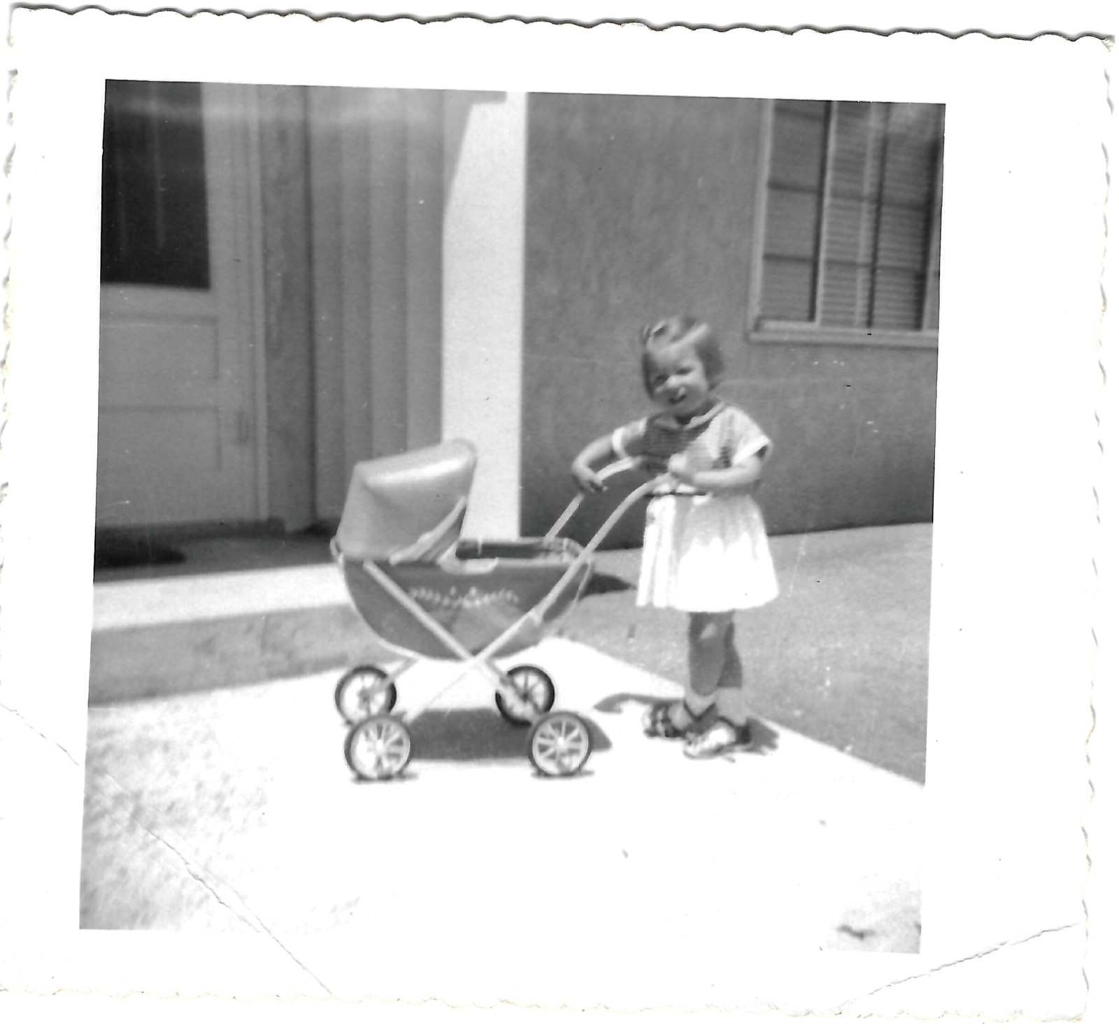 Betty outdoors with a pram