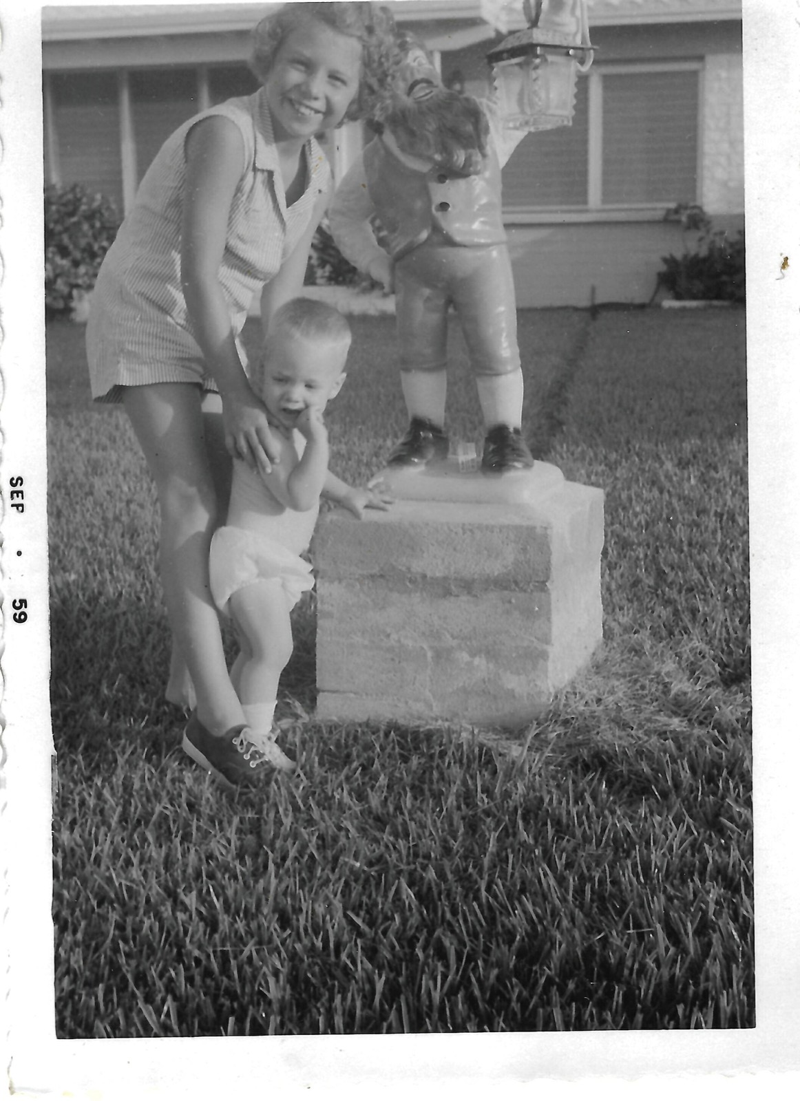 Betty and Bill beside a statue