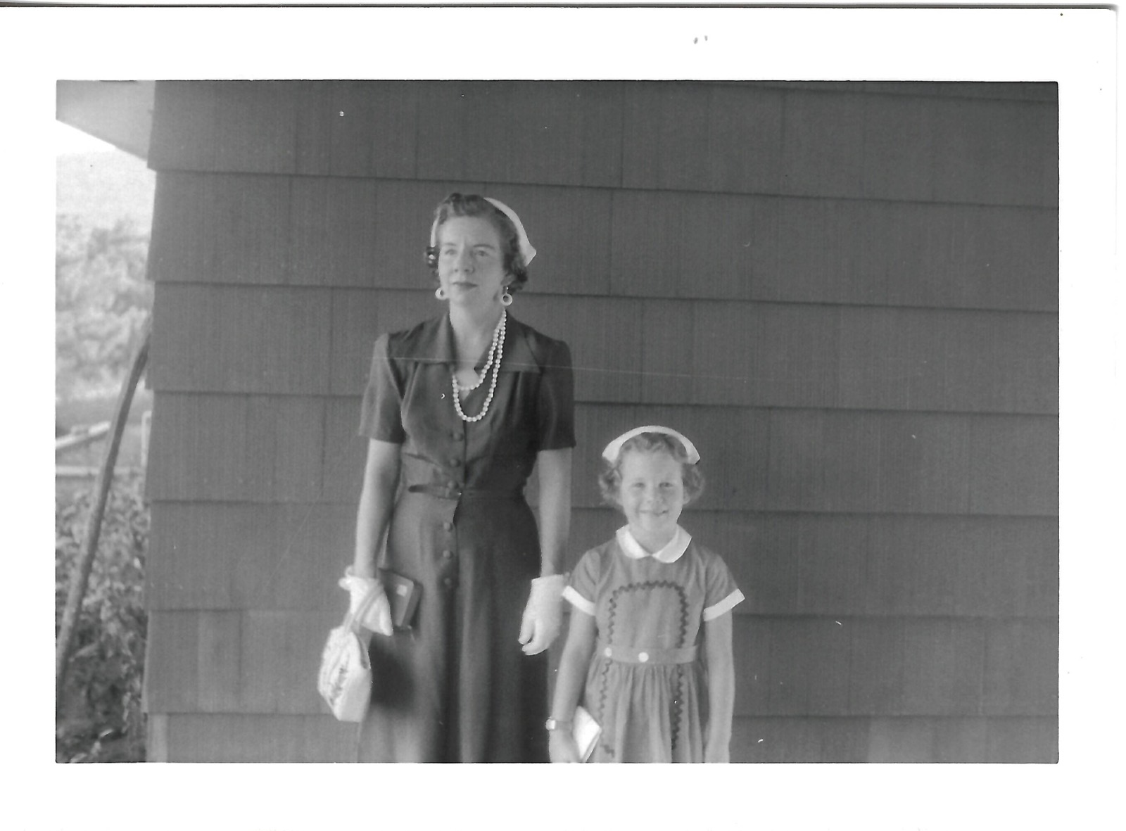 Jean and Betty by a wall