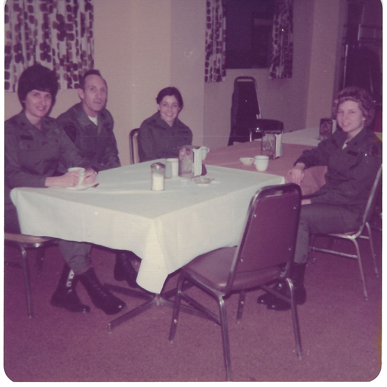 Four people seated at table
