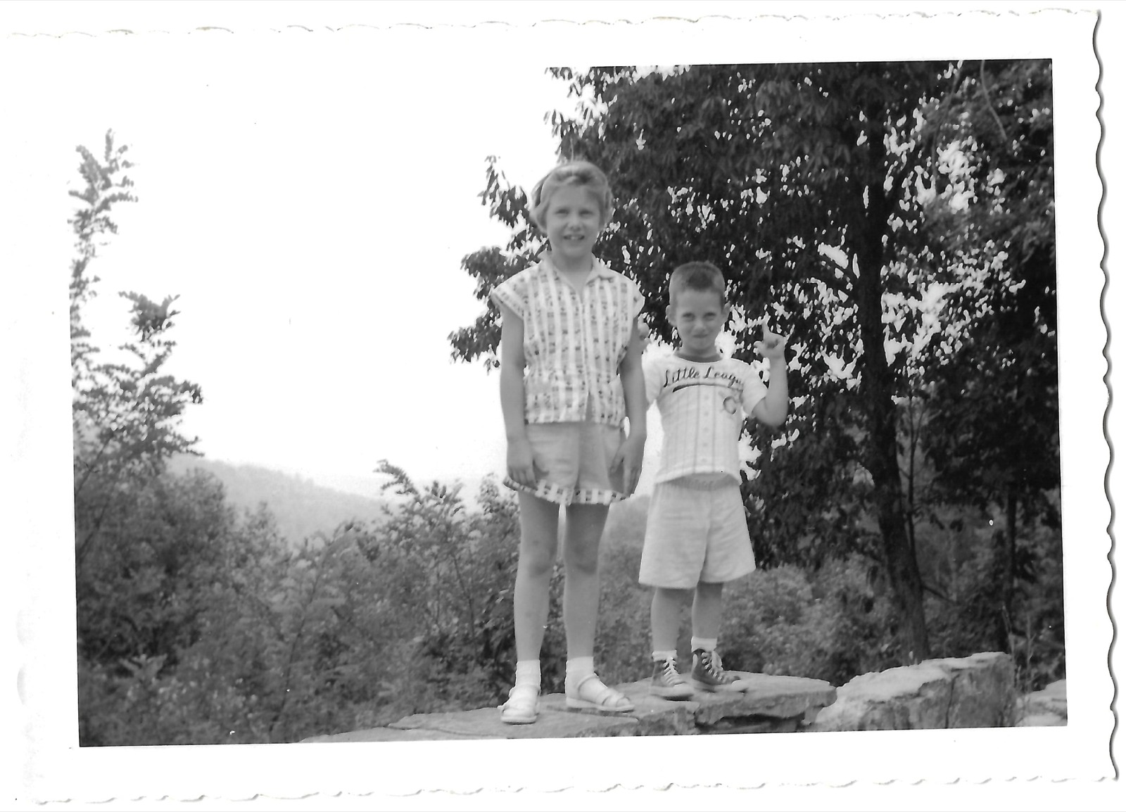 Betty and Bob by a stone wall