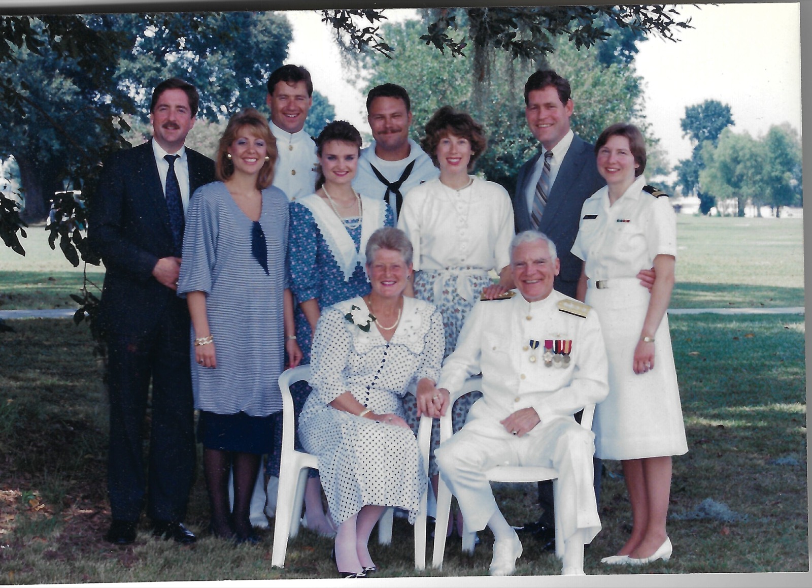 Family and service members outdoors