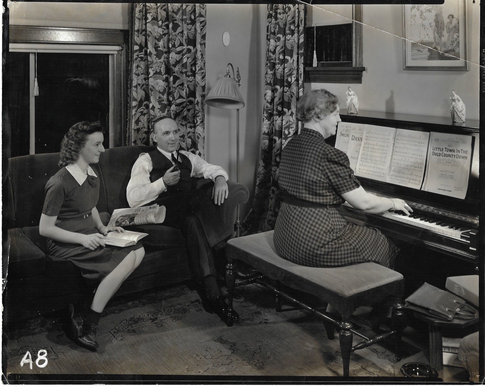 Relatives gathered by a piano