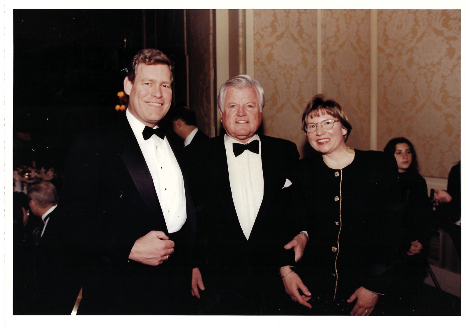Three people dressed for an evening event