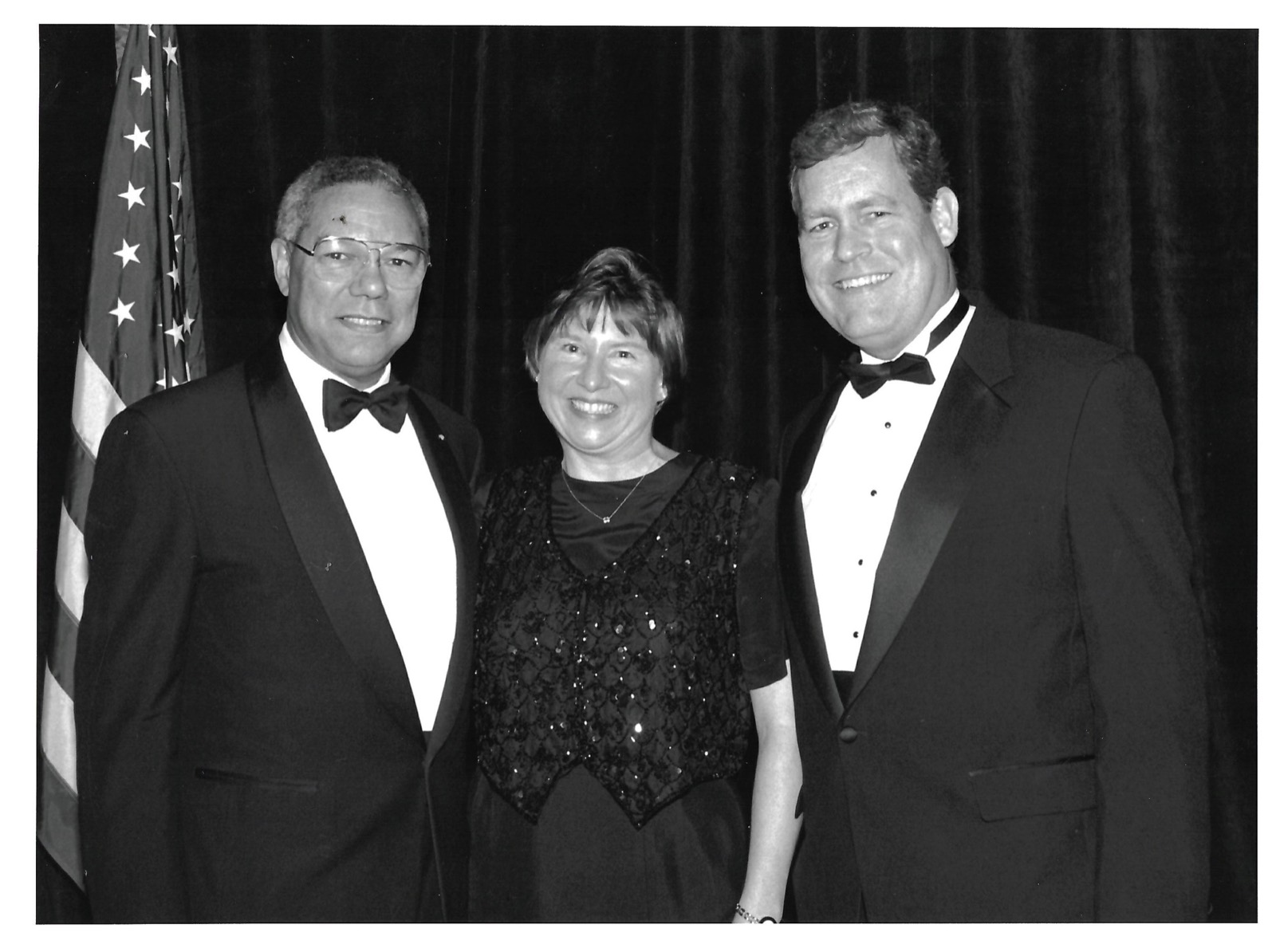 Three people dressed for an evening event, second photograph