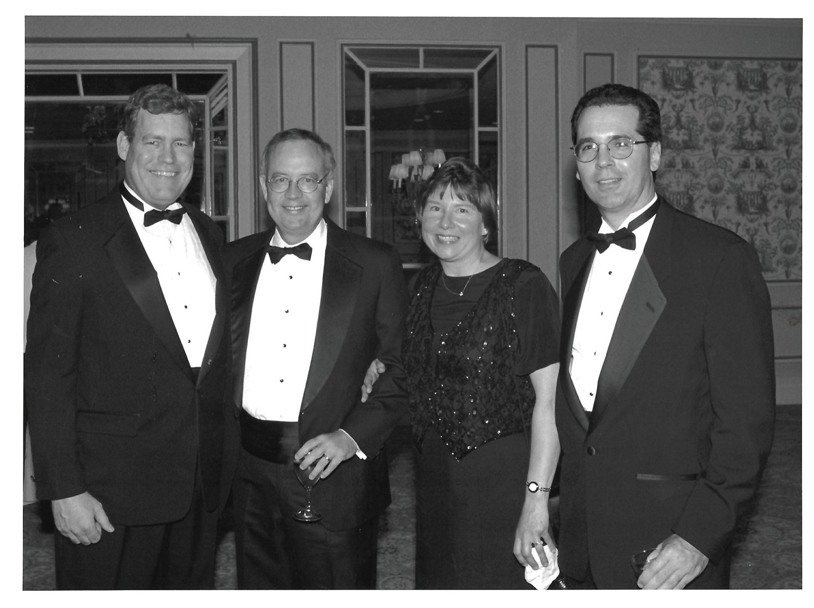Four people dressed for an evening event