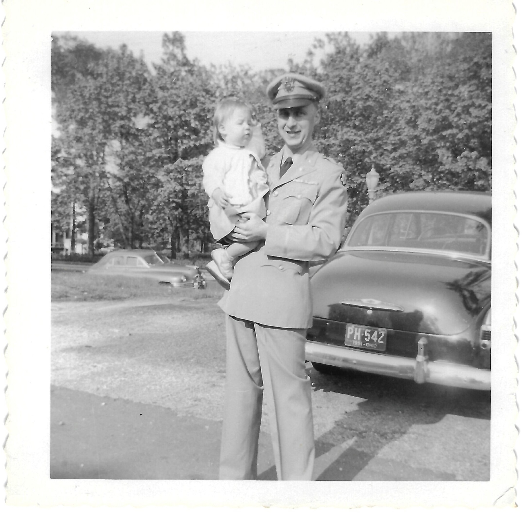 Betty with her father Jack beside a car