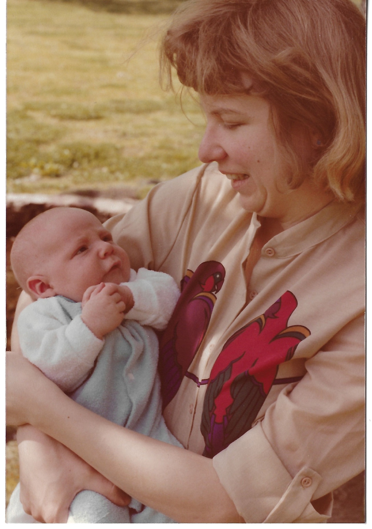 Betty holding her son Dave outdoors
