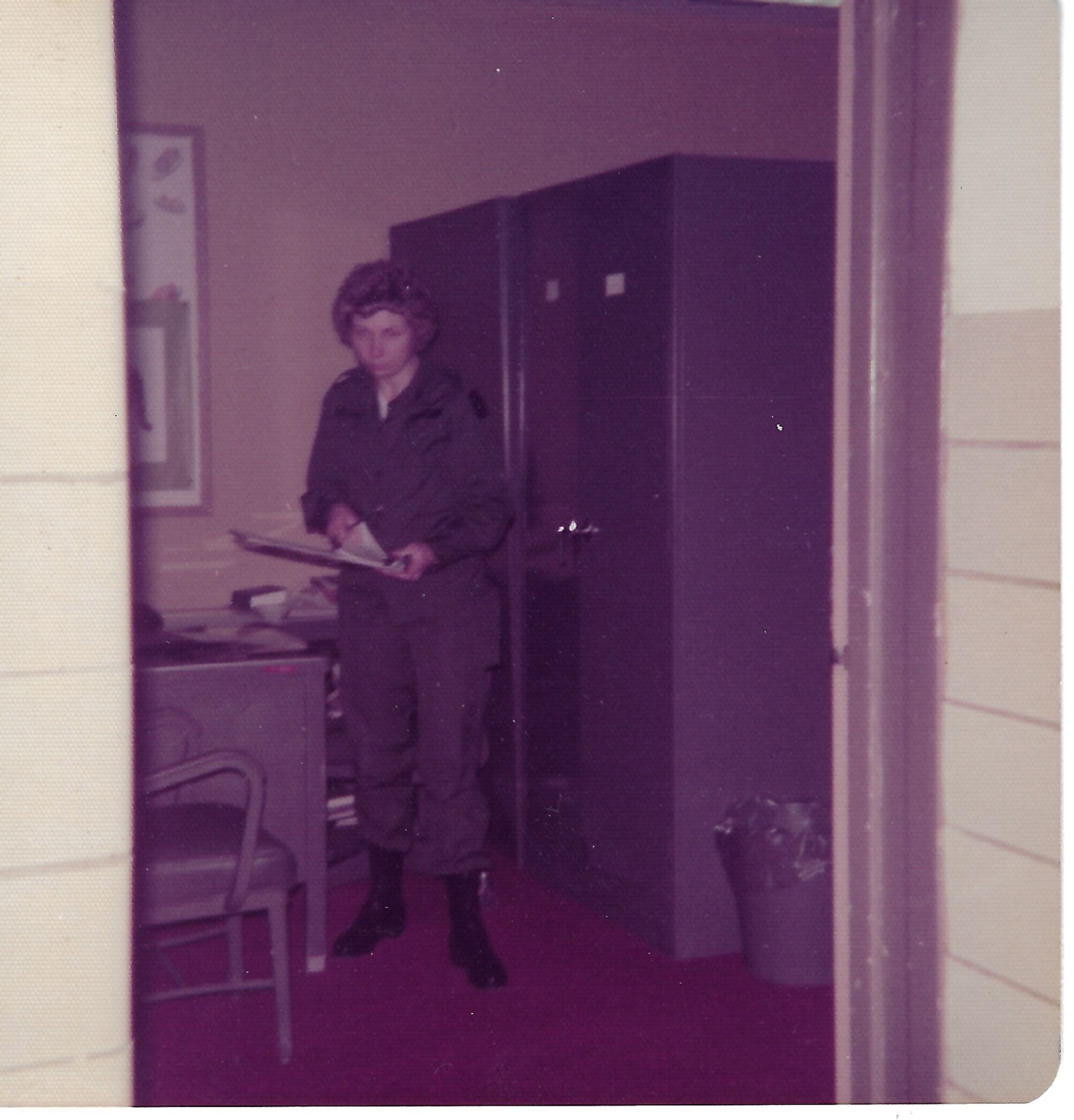 Betty in uniform at a doorway; date not confirmed