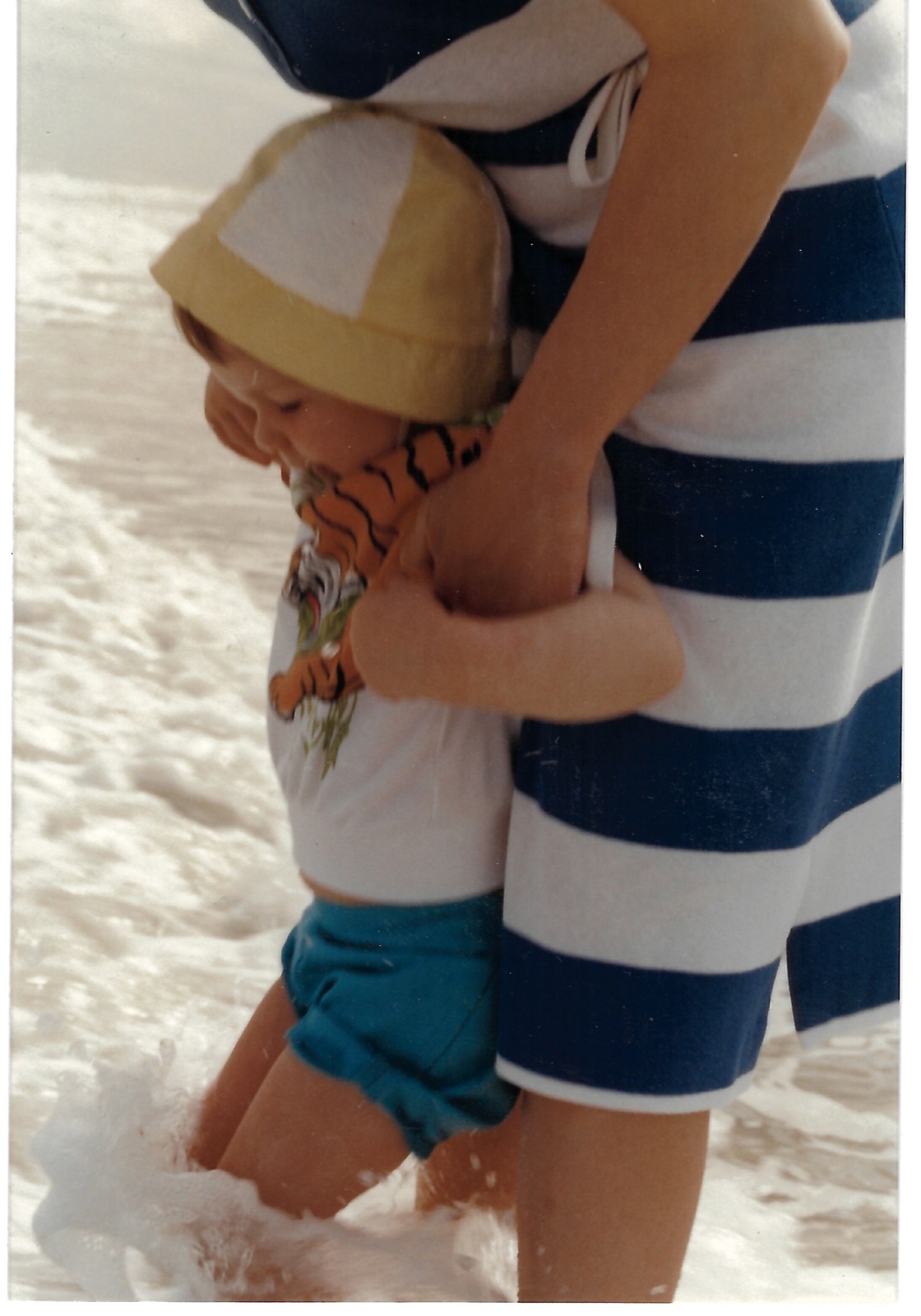 Betty holds Eileen in the Florida surf; Eileen wears her favorite tiger shirt, February 1982.