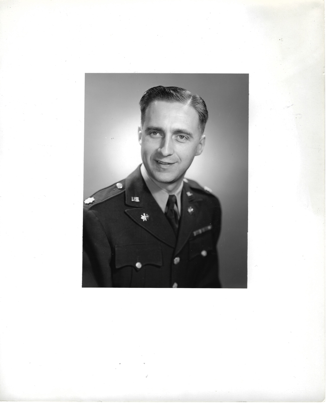 Jack Newman in uniform, 1951; three-quarter portrait on a large white mount.