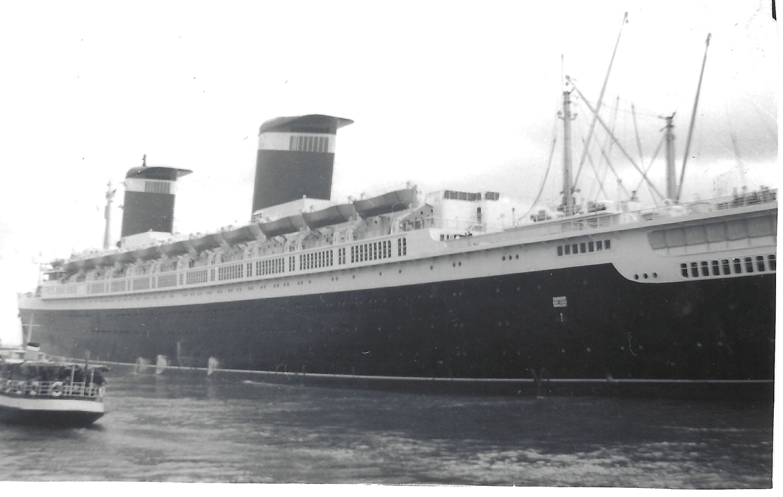 An ocean liner at dock; its connection to the family’s England voyage is unconfirmed.