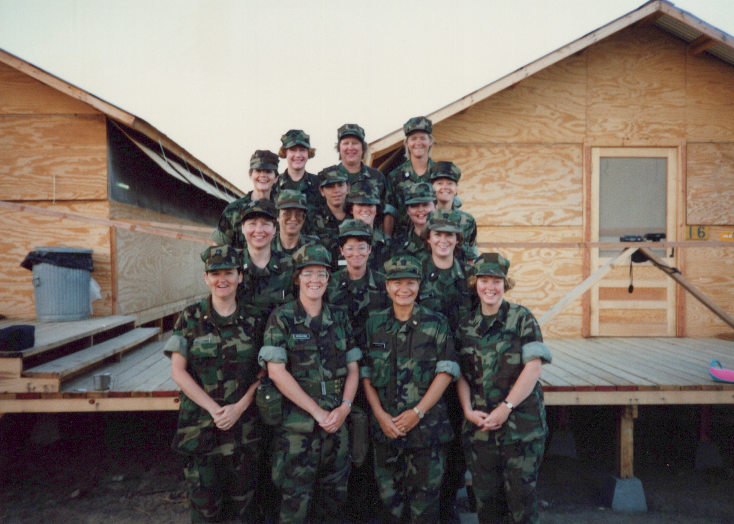 Fleet Hospital 007: Group of uniformed personnel posed outside a building.